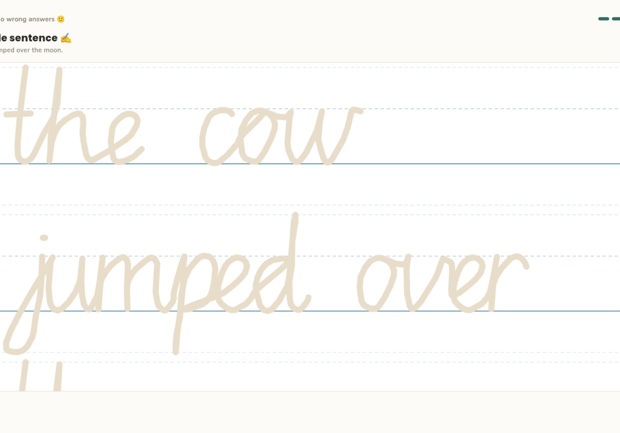 A child writing a cursive sentence on the four-line stave on an iPad